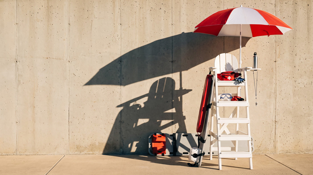 Fully equipped lifeguard stand with rescue tube, backboard, hip pack and whistle