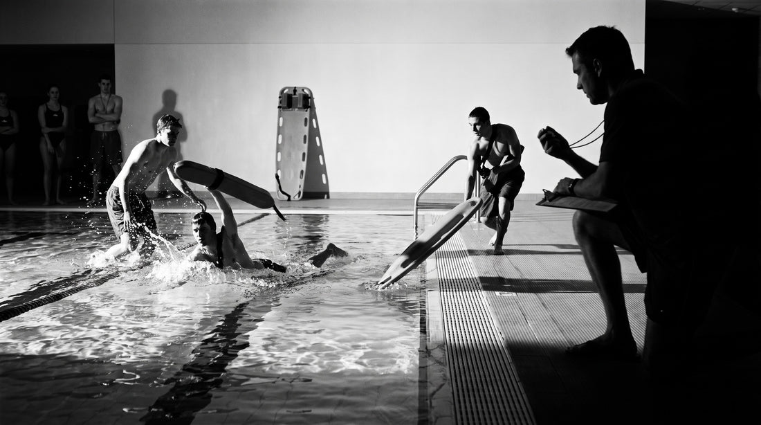 Lifeguards practising rescue tube entries during an in-service training session