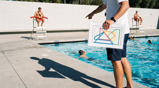 Supervisor briefing lifeguards on overlapping coverage zones using a laminated pool diagram
