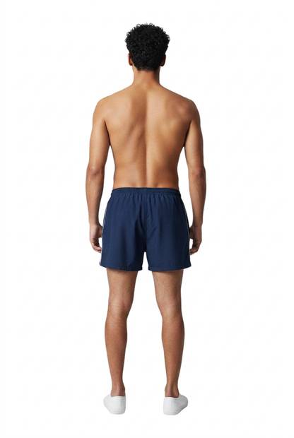 The Lifeguard Store navy blue nylon trunks with white side piping and elastic waistband.