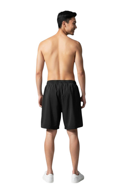 The Lifeguard Store black polyester board shorts with liner, elastic waistband, and cargo pocket. UPF30+.