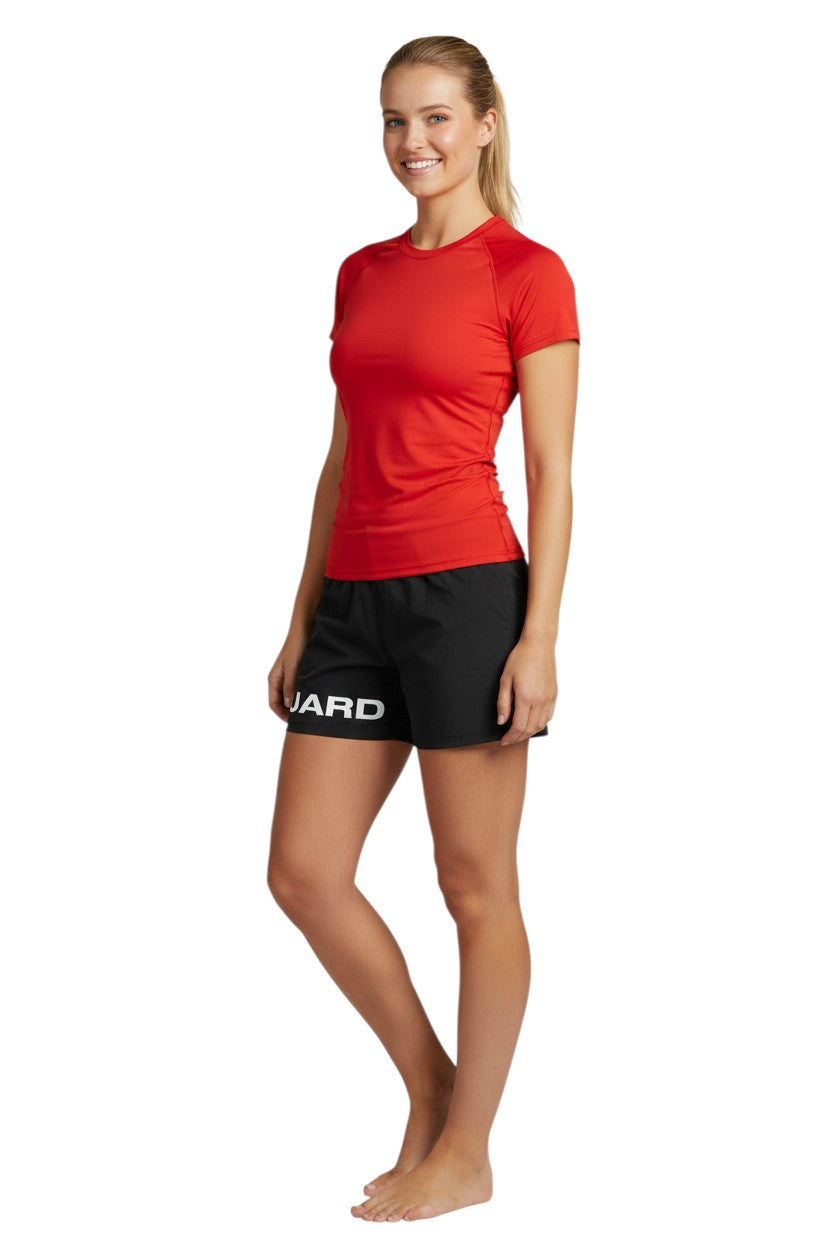 The Lifeguard Store black 4-way stretch unisex lifeguard deck shorts with "GUARD" printed on the leg. 100% polyester.