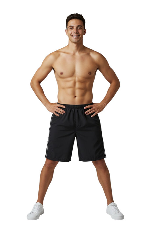 The Lifeguard Store black polyester spandex boardshorts with white piping and GUARD+ logo on side.