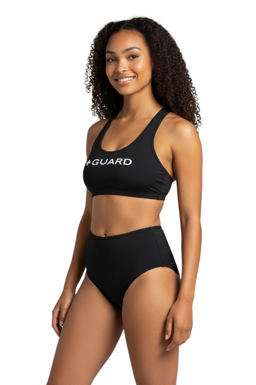 The Lifeguard Store black racer back top with white "+ GUARD" graphic. Made of polyester and spandex.