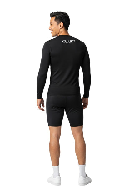 The Lifeguard Store black long sleeve crew neck rashguard with GUARD text on back. Made of poly-spandex blend.