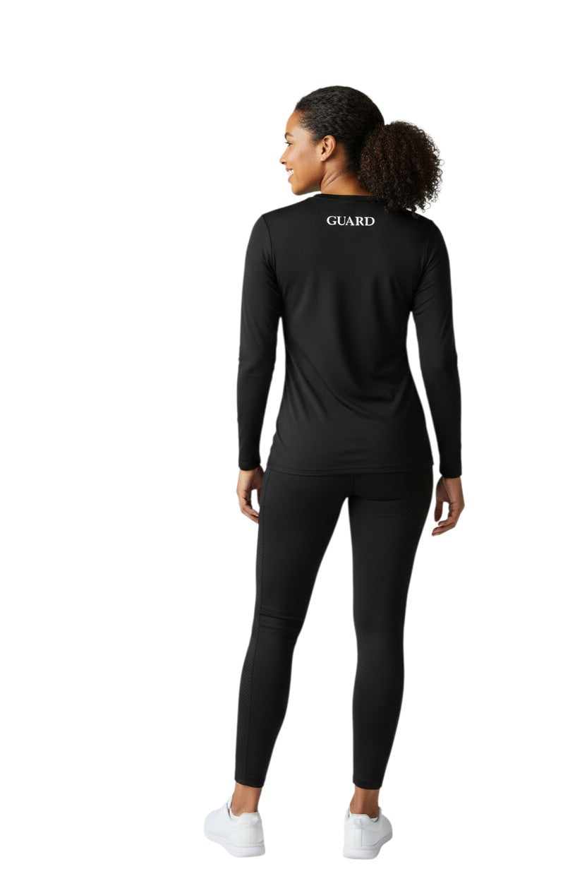 The Lifeguard Store black long sleeve crew neck rashguard with GUARD text on back. 91% Polyester, 9% Spandex.