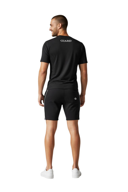 The Lifeguard Store black short sleeve crew neck rashguard with GUARD text on back. Made of 91% polyester/9% spandex.