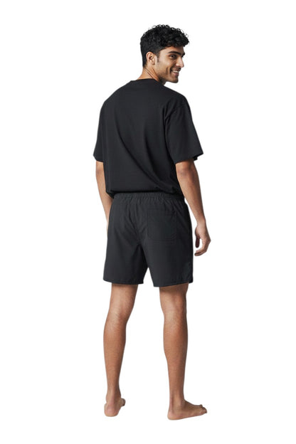 The Lifeguard Store black polyester 5" swim shorts with liner and white GUARD logo detail.
