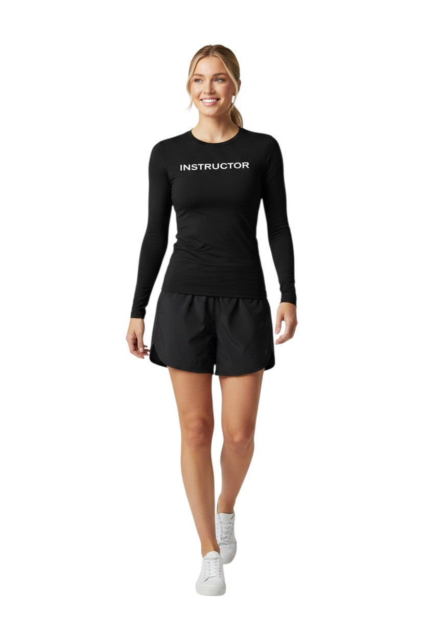 The Lifeguard Store black long sleeve rashguard with "INSTRUCTOR" printed in white on the chest. Made of poly-spandex blend.