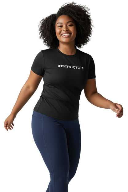The Lifeguard Store black short sleeve rashguard with white instructor text. Poly stretch fabric with UPF50+ protection.