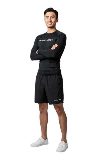 The Lifeguard Store black long sleeve rashguard with "INSTRUCTOR" printed on the chest. Made of poly-spandex blend for comfort and UPF 50+ protection.