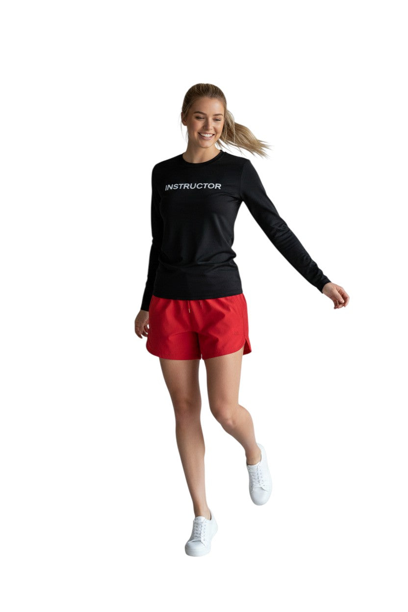 The Lifeguard Store black long sleeve rashguard with "INSTRUCTOR" printed in white on the chest. Made of poly-spandex blend.