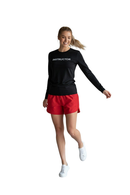 The Lifeguard Store black long sleeve rashguard with "INSTRUCTOR" printed in white on the chest. Made of poly-spandex blend.