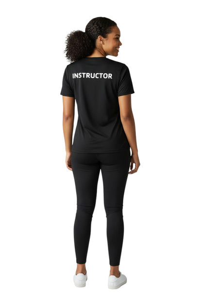 The Lifeguard Store black short sleeve rashguard with white "INSTRUCTOR" text on back. Made of 91% polyester/9% spandex.