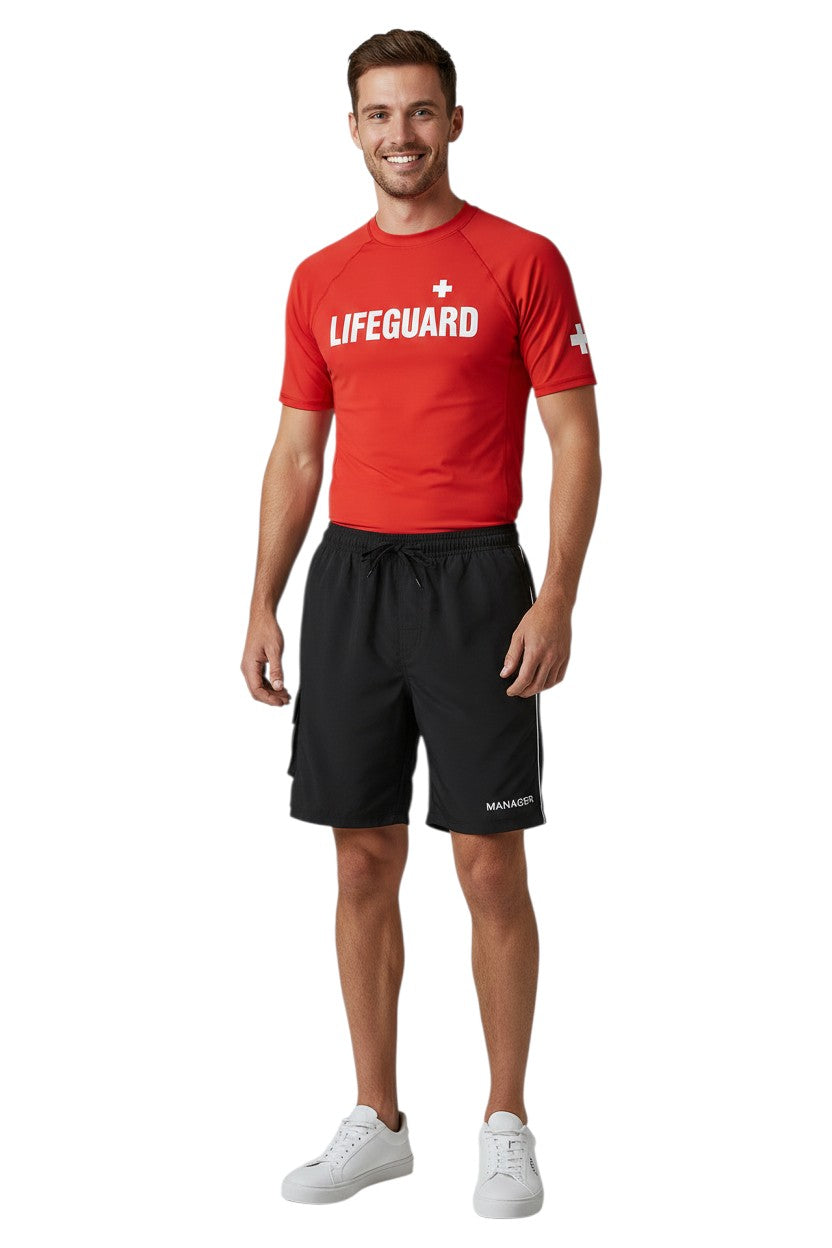 The Lifeguard Store black polyester board shorts with liner, elastic waistband, drawstring, and cargo pocket. Features "MANAGER" text.