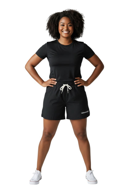 The Lifeguard Store black polyester roll shorts with elastic waistband, drawstring, and "MANAGER" text.