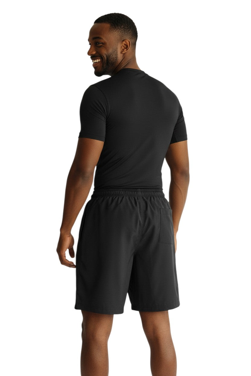 The Lifeguard Store black polyester board shorts with elastic waistband and 7" inseam. Features UPF 50+ protection.
