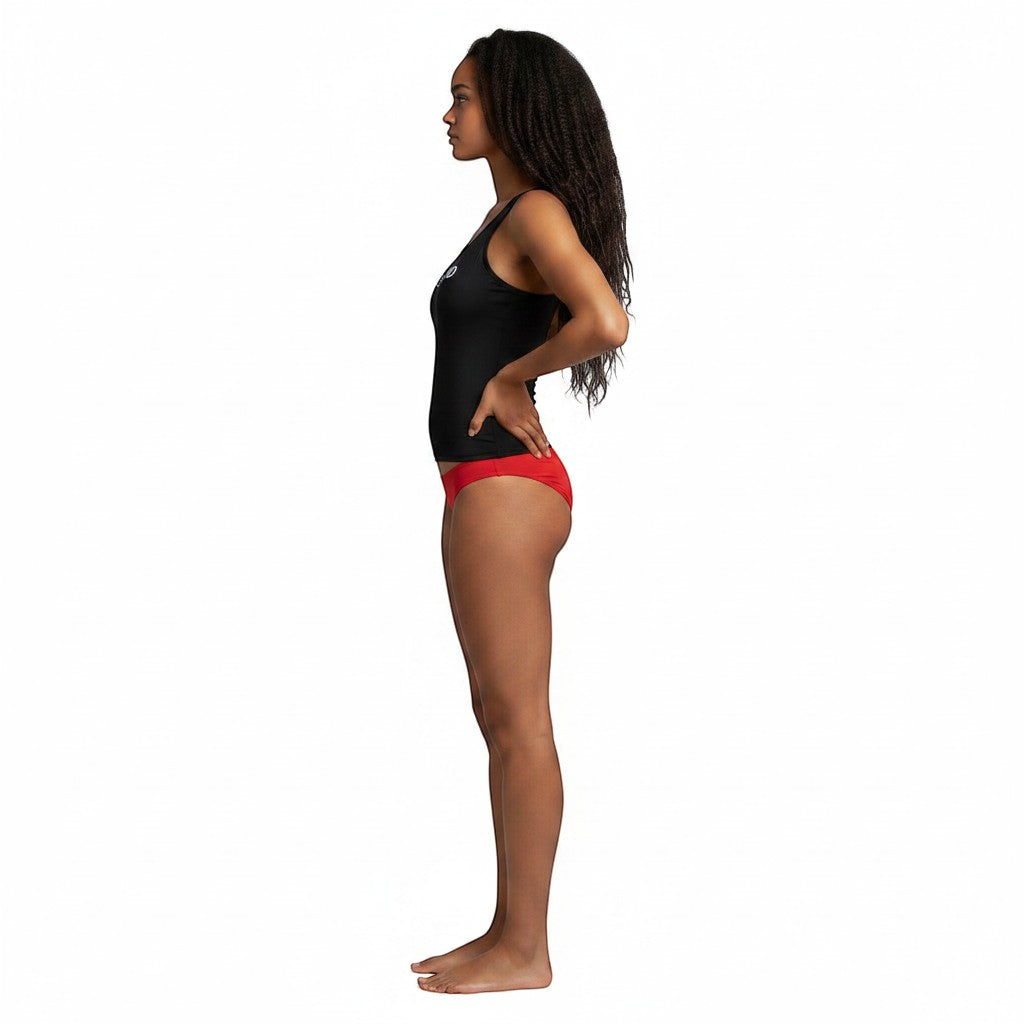 The Lifeguard Store Kiefer Guard black racer back tankini top worn by a model, side view.