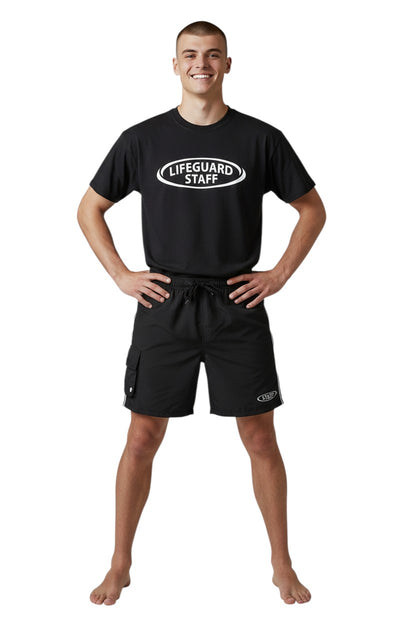 The Lifeguard Store black polyester board shorts with elastic waistband, drawstring, cargo pocket, and staff logo. 7" inseam.