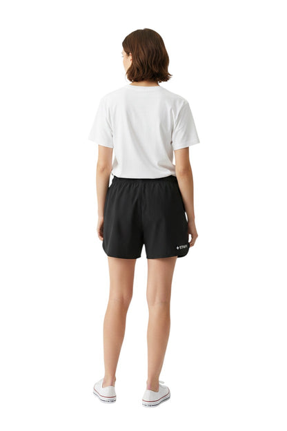The Lifeguard Store black polyester 5" inseam shorts with elastic waistband, drawstring, and "+ STAFF" graphic.