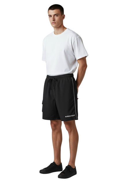 The Lifeguard Store black polyester supervisor board shorts with liner, elastic waistband, drawstring, and cargo pocket.