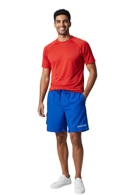 The Lifeguard Store blue polyester board shorts with elastic waistband, drawstring, cargo pocket, and "+ GUARD" graphic.