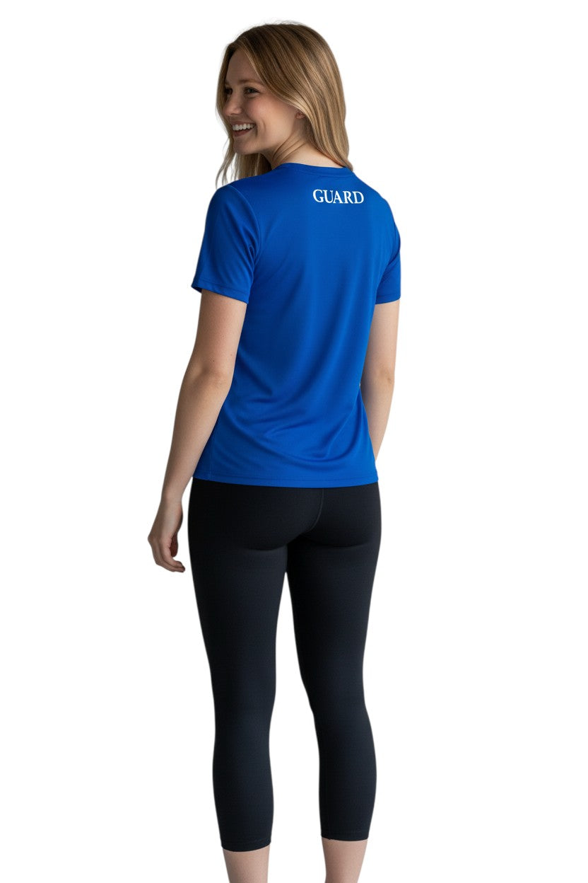 The Lifeguard Store blue short sleeve crew neck rashguard with GUARD text on back. Polyester/spandex blend.
