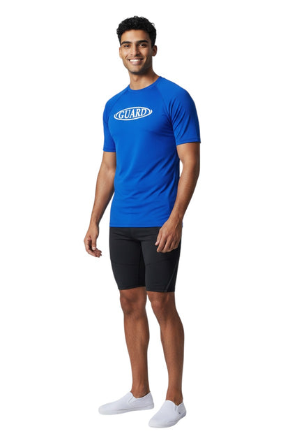 The Lifeguard Store blue short sleeve crew neck rashguard with white GUARD logo on chest. Polyester/spandex blend.