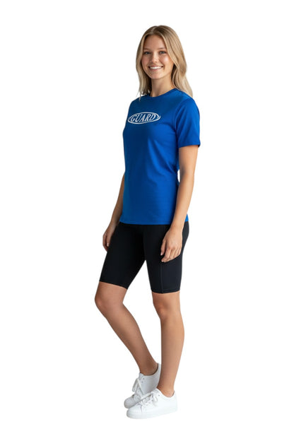The Lifeguard Store blue short sleeve crew neck rashguard with white GUARD logo on chest. Polyester-spandex blend.