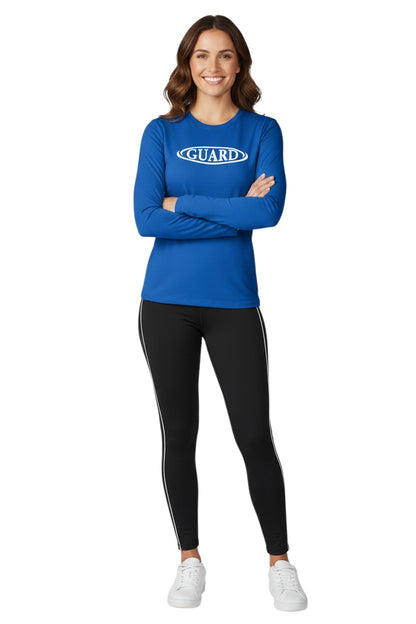 The Lifeguard Store royal blue long sleeve crew neck rashguard with white GUARD logo on chest. Made of poly-spandex blend.