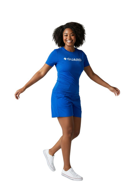 The Lifeguard Store blue short sleeve crewneck rashguard with white + GUARD text on chest. UPF50+ protection.