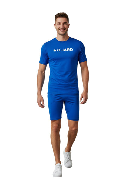 The Lifeguard Store blue short sleeve crewneck rashguard with white + GUARD text on chest. Made of poly stretch fabric.
