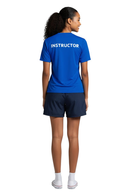 The Lifeguard Store blue short sleeve rashguard with white "INSTRUCTOR" text on back. 91% Polyester/9% Spandex.