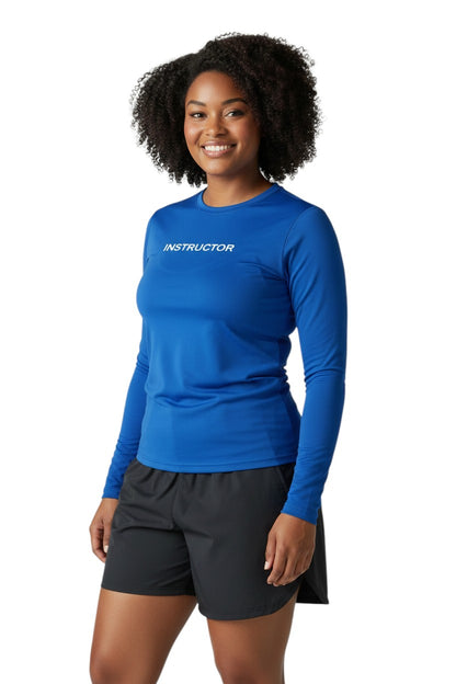 The Lifeguard Store blue long sleeve rashguard with "INSTRUCTOR" printed on the chest. Made of poly-spandex blend for UPF 50+ protection.