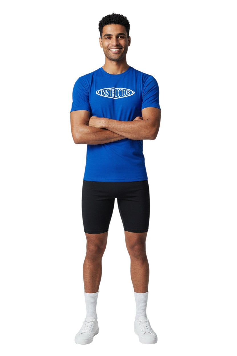 The Lifeguard Store royal blue short sleeve rashguard with white oval 'INSTRUCTOR' graphic. Poly-spandex blend.