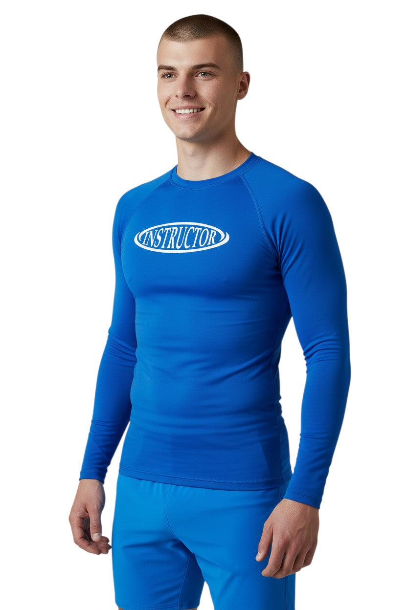 The Lifeguard Store blue long sleeve crew neck rashguard with white oval 'INSTRUCTOR' graphic. UPF50+ protection.