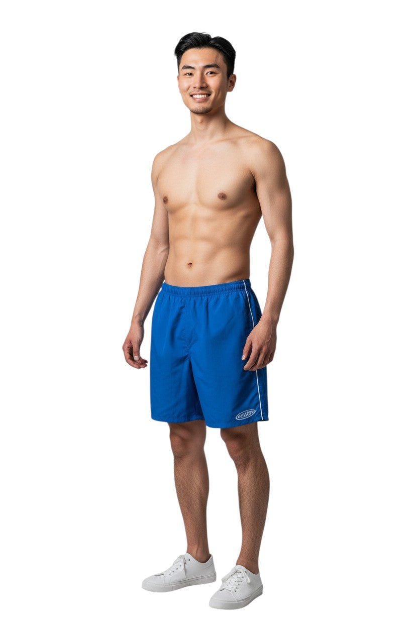 The Lifeguard Store blue nylon Guard Trunk shorts with white piping and Guard logo on left leg. Elastic waistband, 5" inseam.