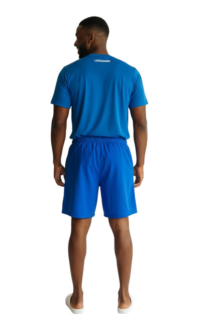 The Lifeguard Store blue polyester board shorts with elastic waistband and 7" inseam.