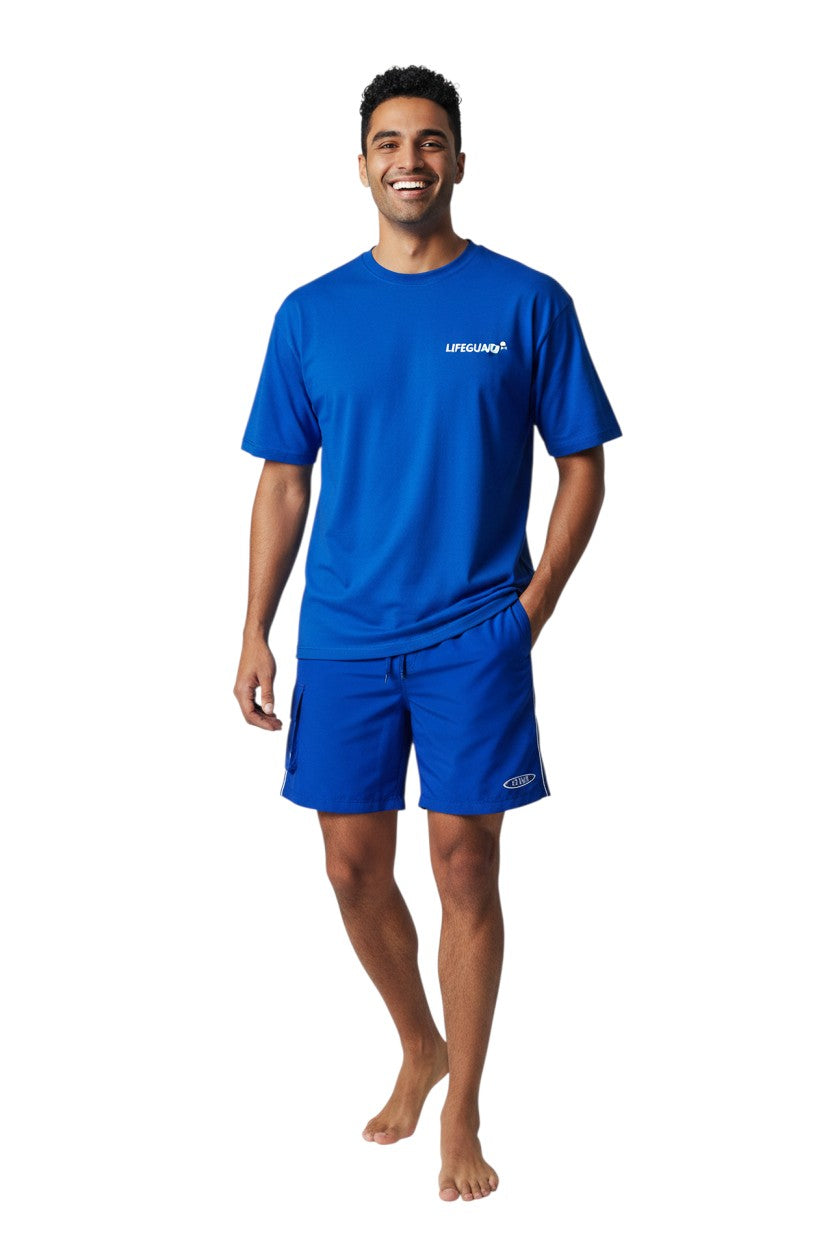 The Lifeguard Store blue polyester board shorts with elastic waistband, drawstring, side cargo pocket, and staff logo.