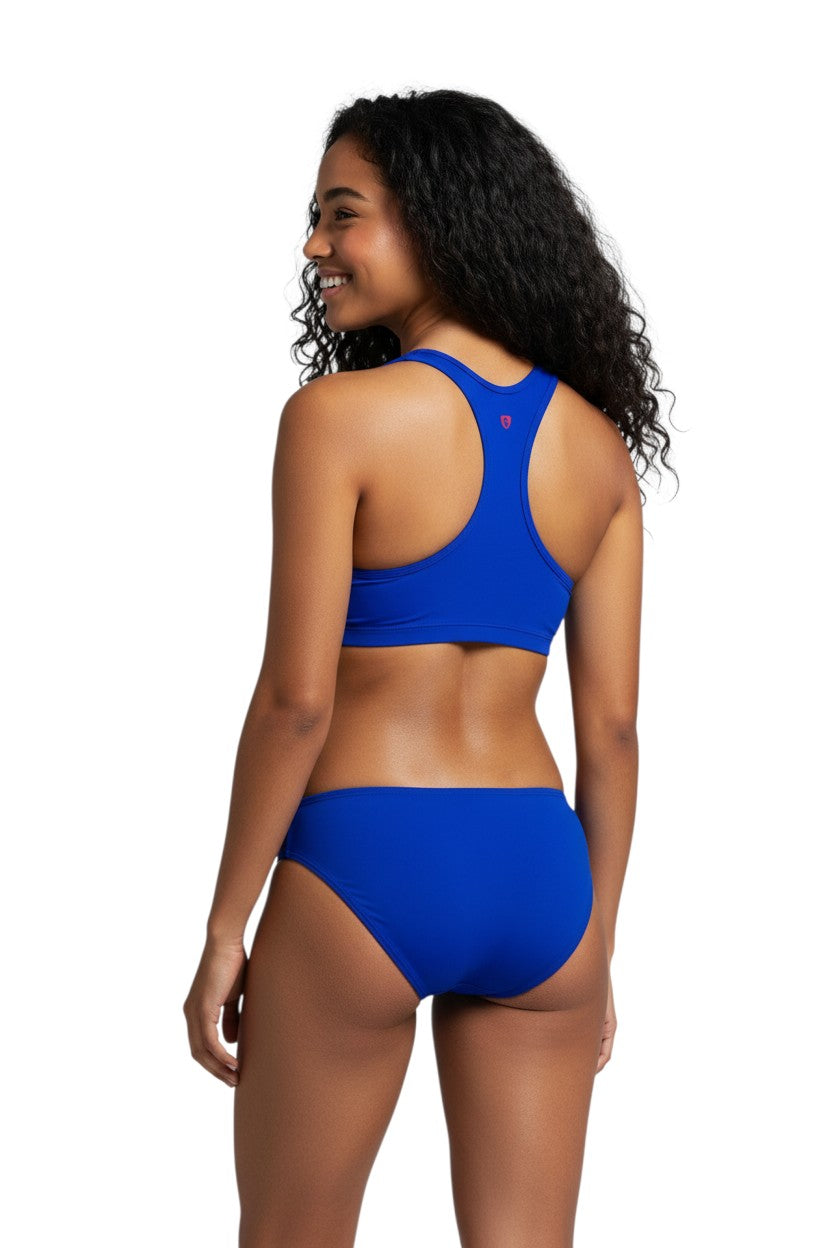 The Lifeguard Store blue poly stretch racer back top with red logo detail. UPF50+ protection.