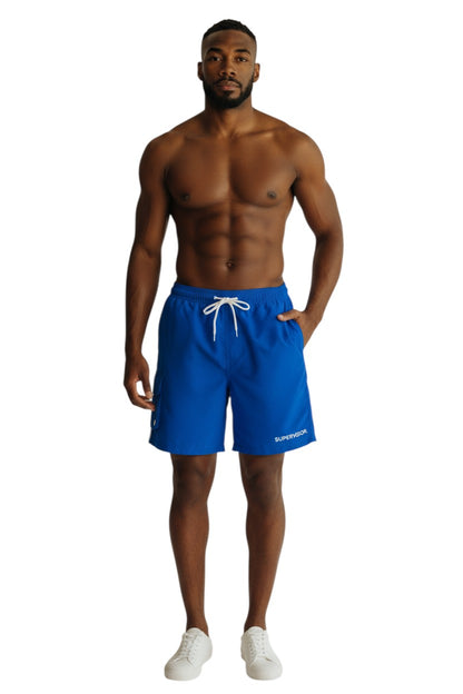 The Lifeguard Store blue polyester board shorts with liner, elastic waistband, drawstring, and cargo pocket. Features UPF30+ protection.