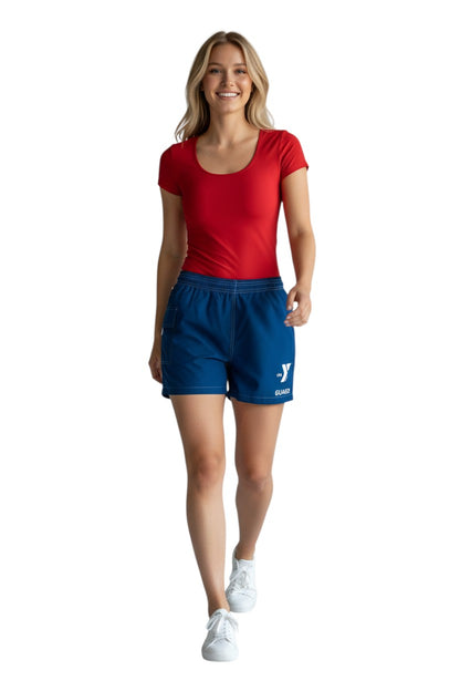 The Lifeguard Store blue polyester/spandex board shorts with elastic waistband, drawstring, and side pocket. Features YMCA Guard logo.