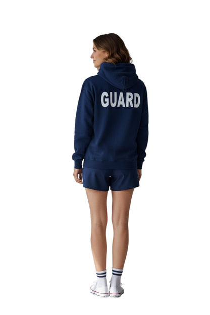 The Lifeguard Store RISE Guard Zip Hoodie in navy blue, cotton-polyester blend with white GUARD logo on back.