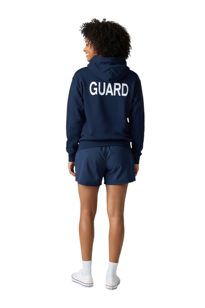 The Lifeguard Store Kiefer Guard Zip Hoodie in navy blue, 50% cotton/50% polyester fleece, with a double-lined hood and drawstring. Features a large white GUARD logo on the back.