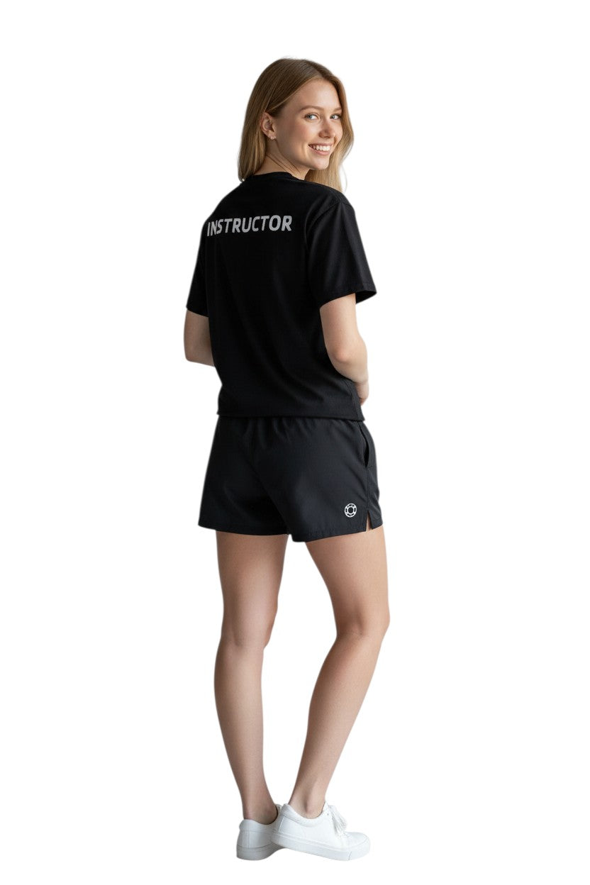 The Lifeguard Store black 100% polyester Dri-Fit tee with "INSTRUCTOR" screened on the upper back.