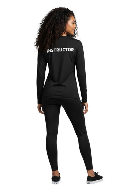 The Lifeguard Store black long sleeve rashguard with "INSTRUCTOR" printed on the back. Made of 91% polyester and 9% spandex.