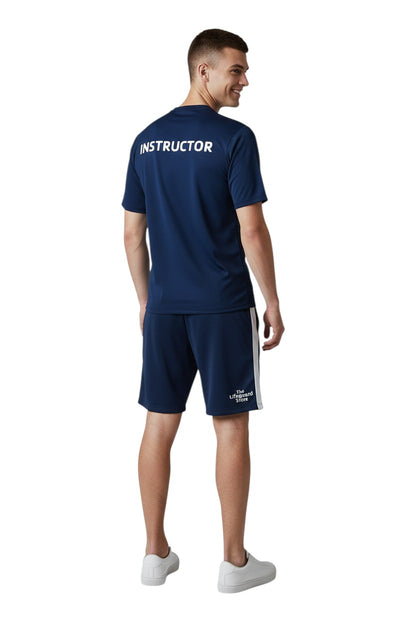 The Lifeguard Store YMCA Kiefer Instructor navy blue short-sleeve rashguard made of polyester and spandex with UPF50+ protection.