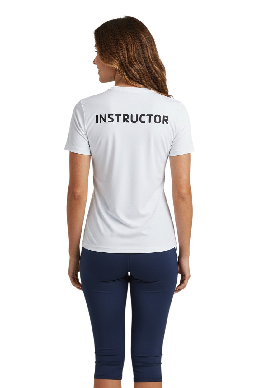 The Lifeguard Store white short-sleeve rashguard with "INSTRUCTOR" printed on the back. Made of polyester and spandex for comfort and UPF 50+ protection.
