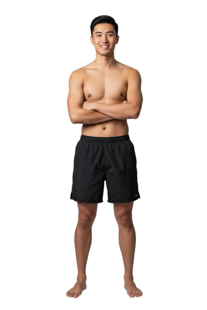 The Lifeguard Store Kiefer 4-Way Unisex Deck Short in black, featuring an elastic waist, side pockets, and a back pocket with velcro closure.