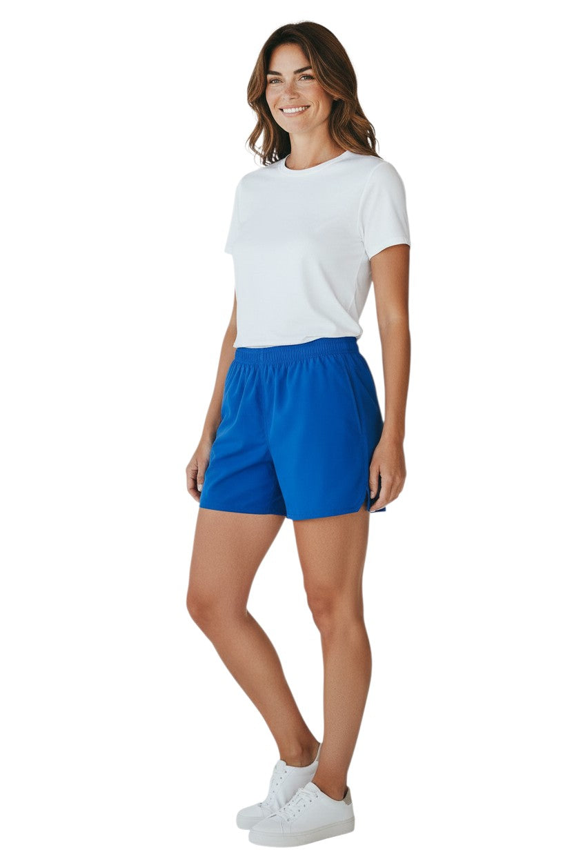 The Lifeguard Store Kiefer 4-Way Unisex Deck Short in solid blue with elastic waist, drawstring, side pockets, and back velcro pocket.